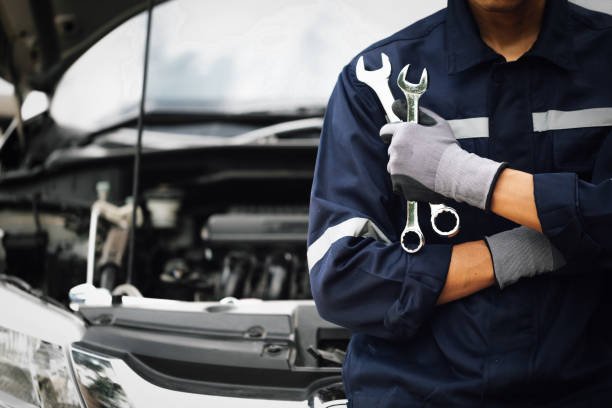 Oxygen Auto technician servicing a car
